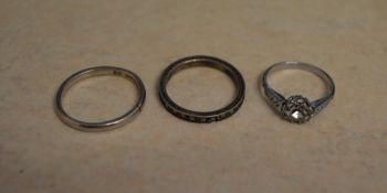 Platinum band and two other rings