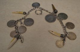 Silver watch chain with various coins, c