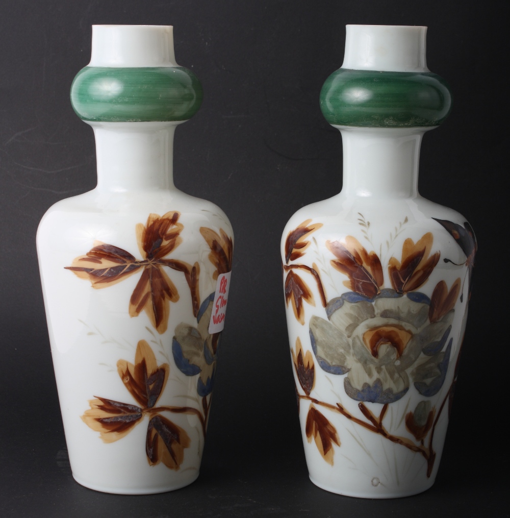 A pair of 19th Century continental floral decorated glass vases