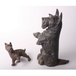 A cast iron door stop in the form of a Scottie dog seated on its haunches, 16" high, and another