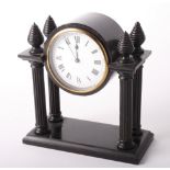 A 19th Century ebonised wood entablature mantel clock, 8" high