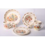 A Doulton Bunnykins cereal bowl, another smaller, two mugs, two egg cups and a plate