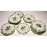 A Bisto china dessert service decorated flowers on a pale green ground comprising eleven plates