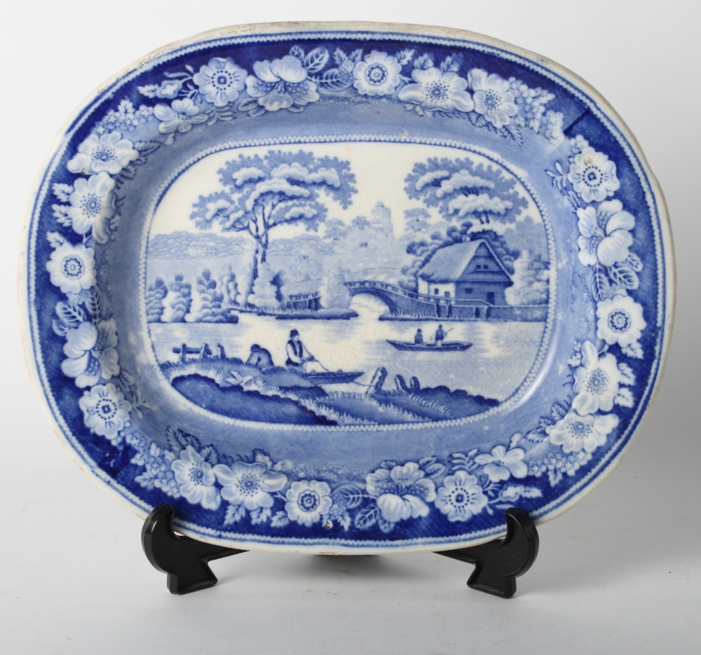 A 19th Century blue and white oval dish with landscape decoration