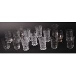 A number of glass tumblers with engraved and cut designs