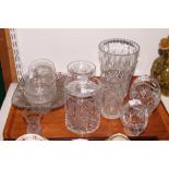 A cut glass biscuit jar and cover, two cut glass baskets, a cut glass waisted vase, a smaller