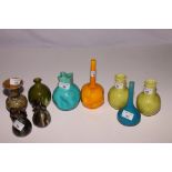 Seven Burmantofts vases in green, orange and turquoise glazes, largest 7 1/2" high, a Doulton