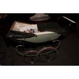 A 1960s Silver Cross pram together with a number of contemporary dolls, various