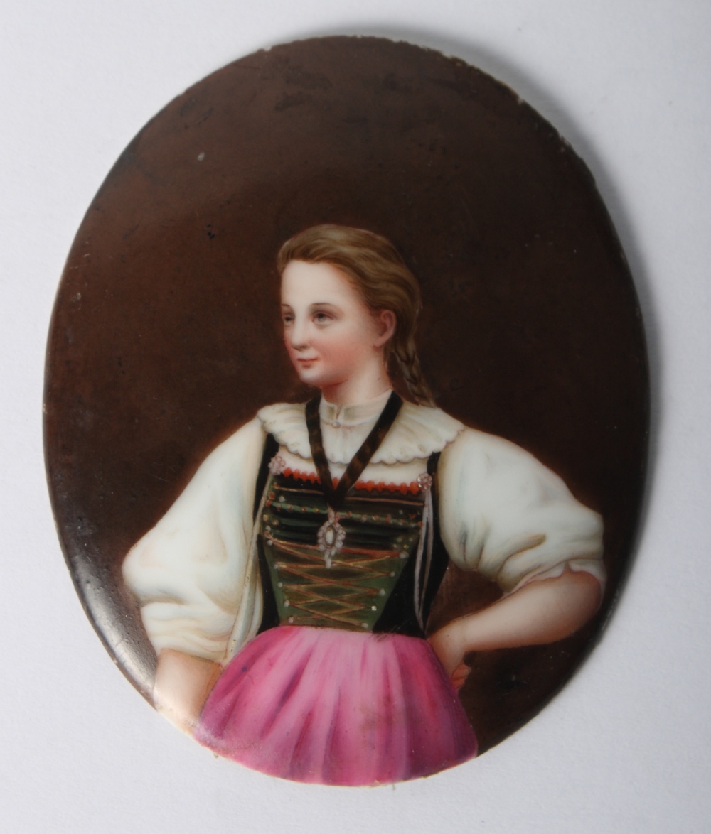 A 19th Century continental porcelain oval portrait panel, woman in regional costume, 3 1/8" x 2 1/