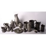 An 18th Century pewter tankard with side spout and wriggle work inscription and a number of other