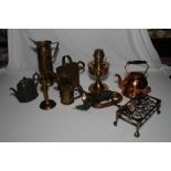 A brass water can, a brass pedestal oil lamp, a copper bugle, a copper electric kettle and other