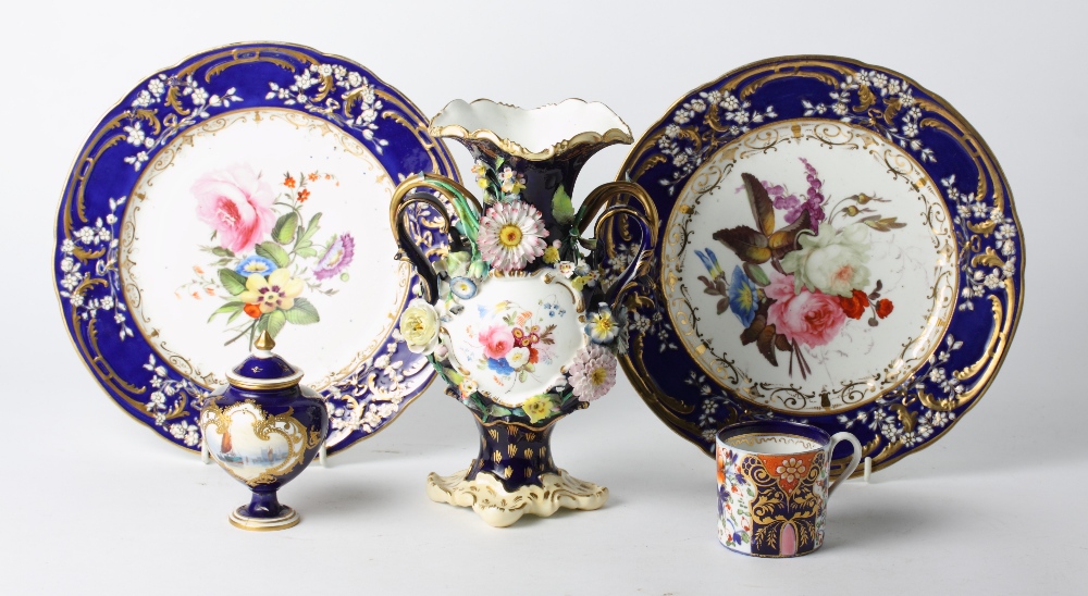 A pair of 19th Century blue and gilt decorated cabinet plates with hand-painted floral centres, a