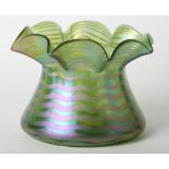 A Loetz green glass vase with flared rim and iridescent banded decoration