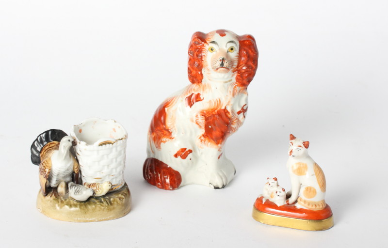 A 19th Century Staffordshire spaniel, 5 1/2" high, a continental porcelain vesta holder with turkey,