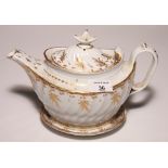 A 19th Century bone china gilt decorated teapot on stand