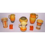 Three Shelley banded ware jugs, two similar vases, a Shelley banded vase in orange and yellow, 10"