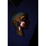 A turquoise and bronzed plaster wall plaque, head of a Native American woman, 13" high