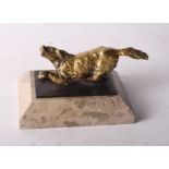 A gilt bronze model of a dog, on marble base, 2 1/2" high