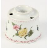 A Champions Bristol inkwell with floral decoration, 3 3/8" dia (rim chips)