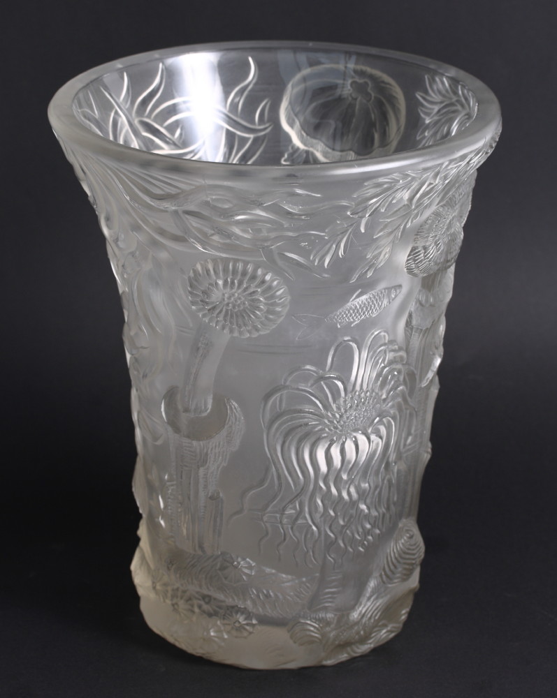 A mid 20th Century pressed and frosted glass trumpet-shaped vase decorated in high relief with