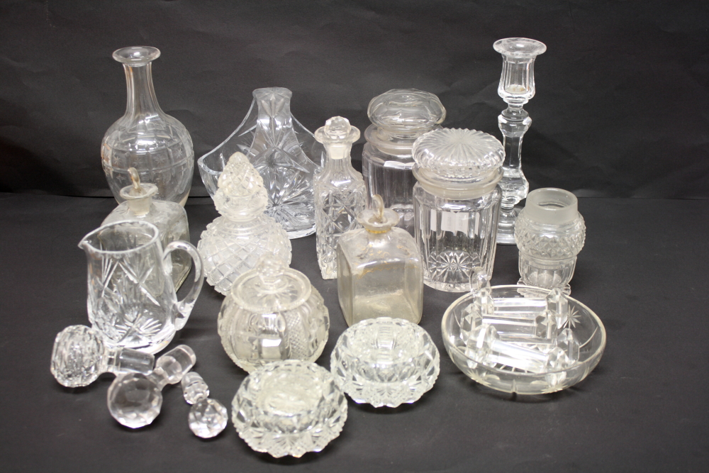 A cut glass basket, a candlestick, a pickle jar and other items of cut glass