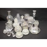 A cut glass basket, a candlestick, a pickle jar and other items of cut glass