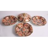 A set of four 19th Century china soup plates with Imari decoration and a matching tureen cover