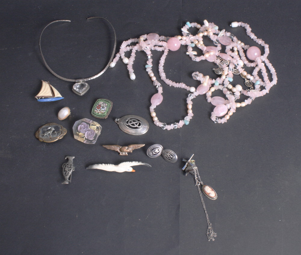 A silver bracelet with pierced decoration with matching pendant and earrings, a marcasite brooch