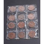 A plastic sleeve containing twelve early 20th Century pennies to include one dated 1933