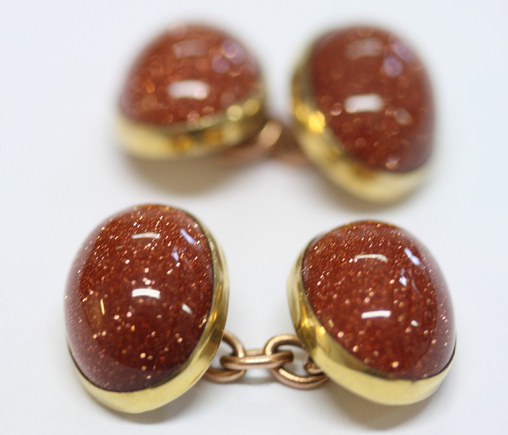 A pair of 9ct gold and sunstone cufflinks