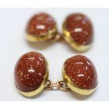 A pair of 9ct gold and sunstone cufflinks