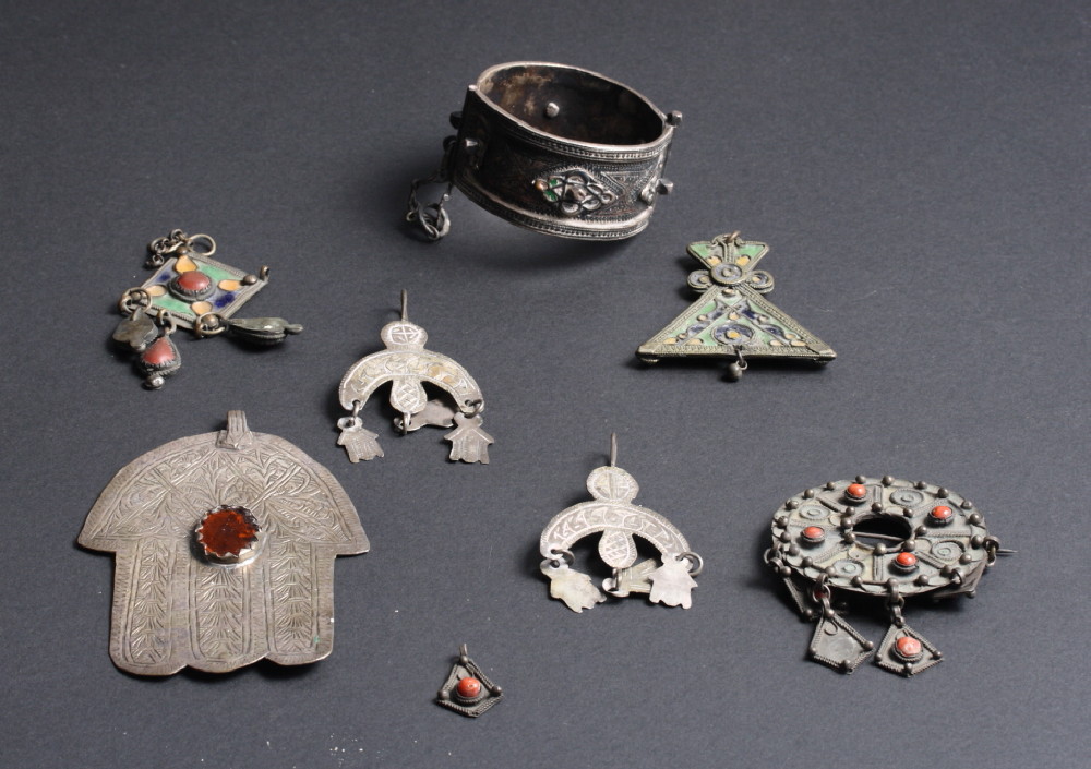 A selection of white metal and other enamelled and stone set ethnic jewellery