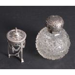 A cut glass scent bomb with embossed silver lid and a Neo-Classical style condiment frame