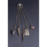 A late 19th Century base metal five-strand chatelaine