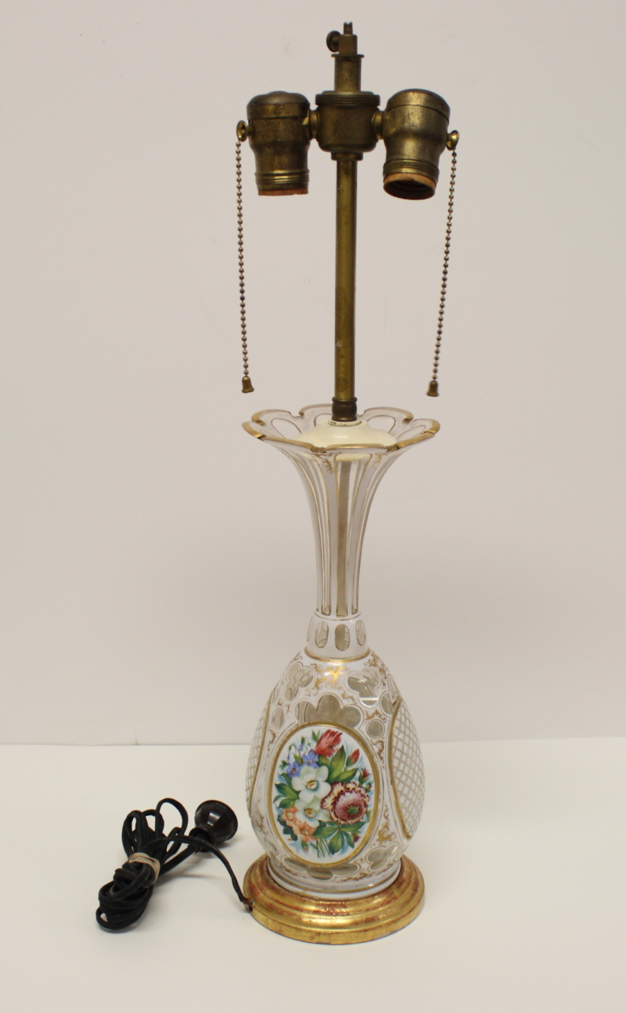 A 19th Century Bohemian glass trumpet vase with floral enamelled panels and gilt scrolled