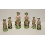 A set of six continental porcelain cherubs with baskets of flowers in the Derby manner, two 6"