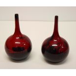 A pair of Doulton flambé sprinkler bottle vases with landscape decoration, 6 1/2" high