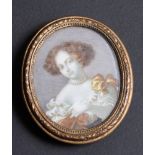 An oval miniature portrait on ivory of a 17th Century lady, in gilt metal frame