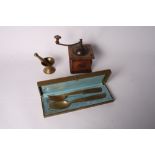 A bronze pestle and mortar, 2 1/2" high, a pair of walnut servers, a beech cased Peugeot coffee