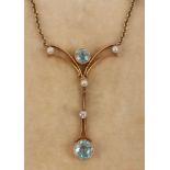 An Edwardian 15ct gold necklace with Art Nouveau pendant set BLUE ZIRCON, seed pearls and a single