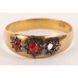 An 18ct gold ring set two red stones, 3g