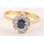 An 18ct gold dress ring cluster set sapphire and diamonds