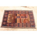 An Afghan Belouch prayer rug decorated upper panel of a mosque on a red and brown panelled ground,