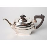 A silver melon-shaped teapot with ebonised knop and handle, 19.3oz troy approx