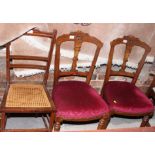 A pair of Victorian occasional chairs with incised decoration to backs, stuffed over seats