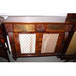 A mid 19th Century rosewood chiffonier, fitted two drawers, with brass grille flanking carved