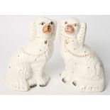 A pair of Staffordshire dogs, 9" high, and a pair of oak candlesticks with scroll carved square