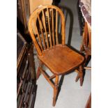 A set of four plain hoop and spindle back kitchen chairs
