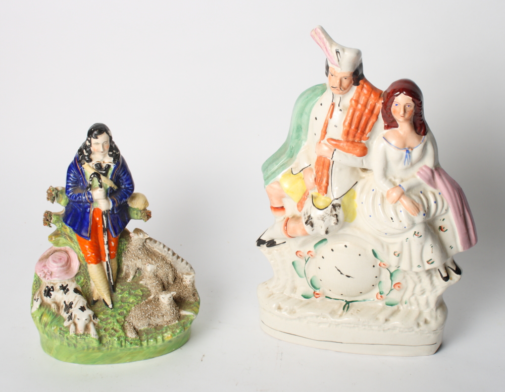 A 19th Century Staffordshire figure group, shepherd, dog and sheep, 9" high, and a 19th Century
