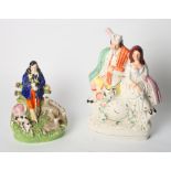 A 19th Century Staffordshire figure group, shepherd, dog and sheep, 9" high, and a 19th Century